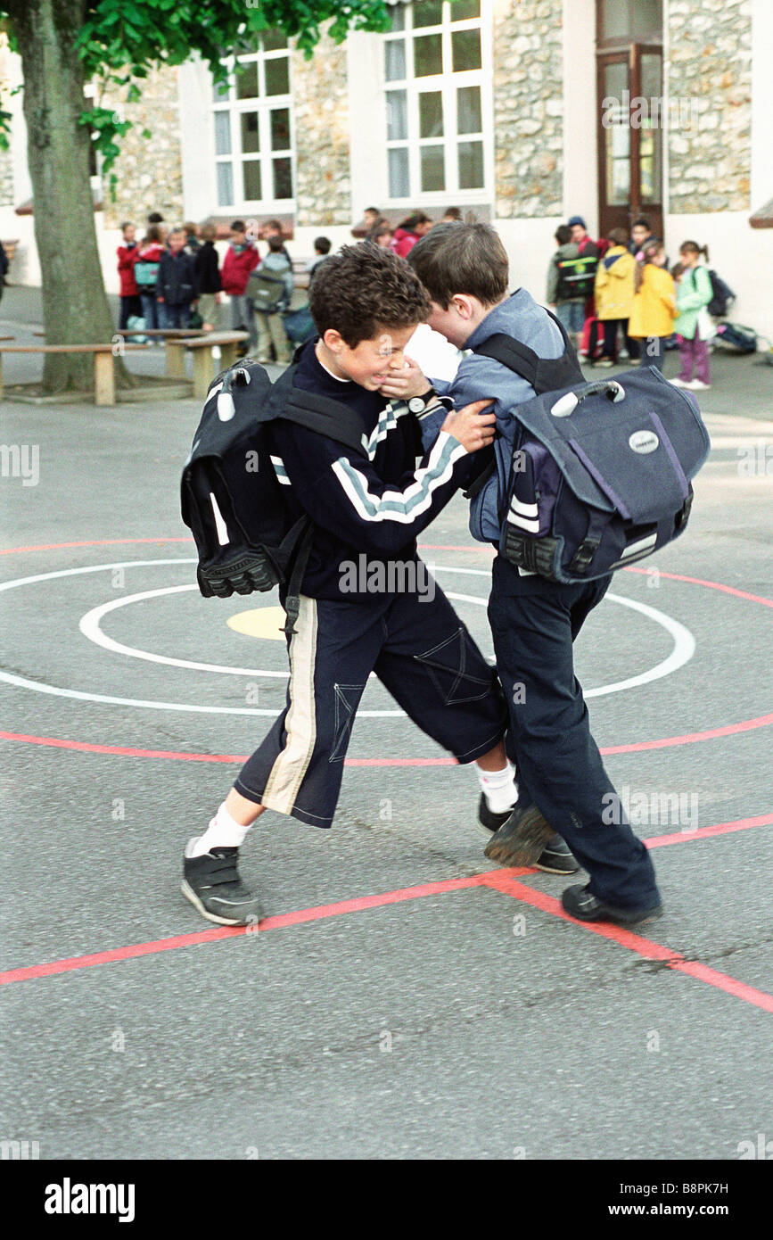 Boys Fighting On School Playground B8PK7H 