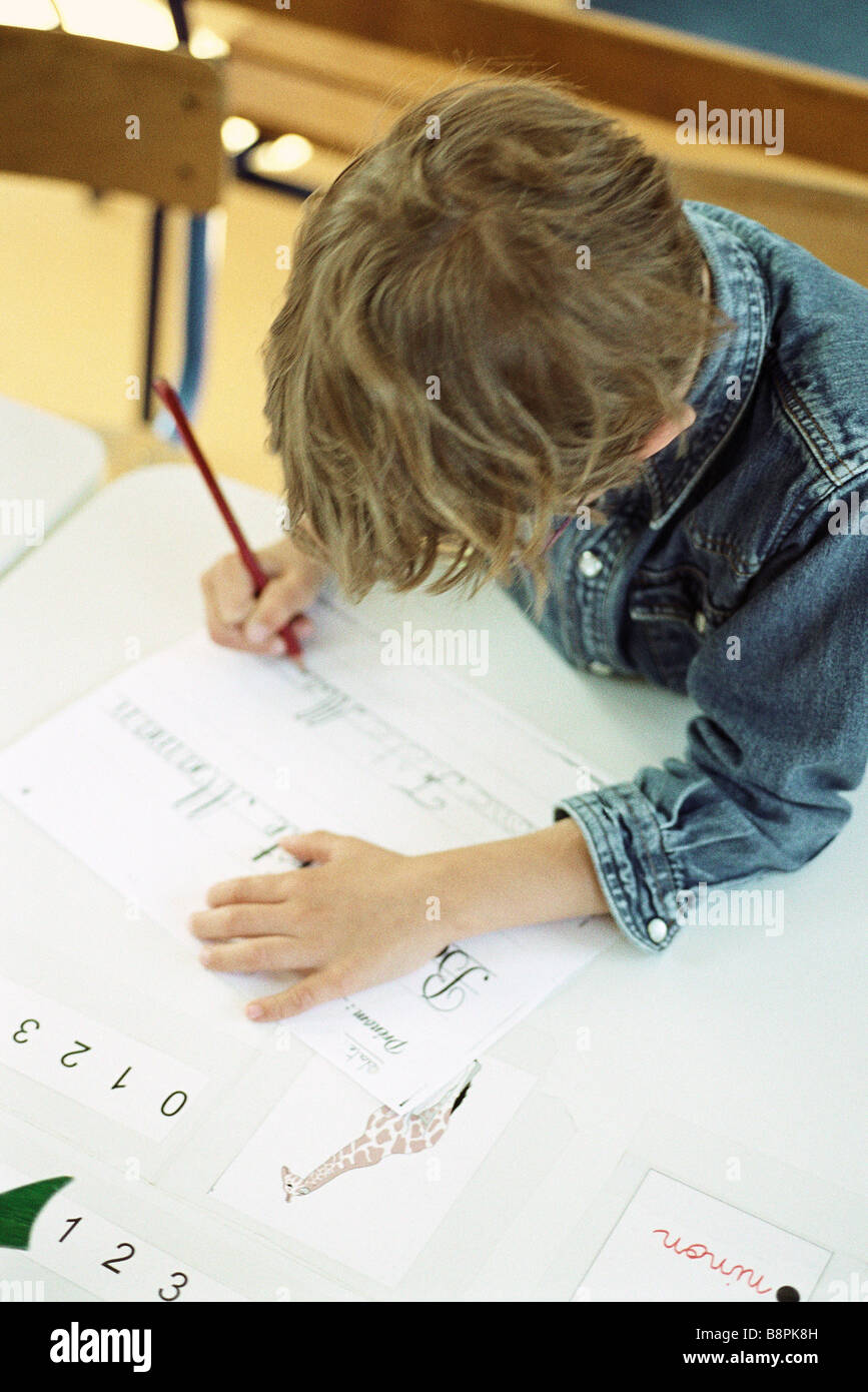 Child working on handwriting exercise, high angle view Stock Photo - Alamy