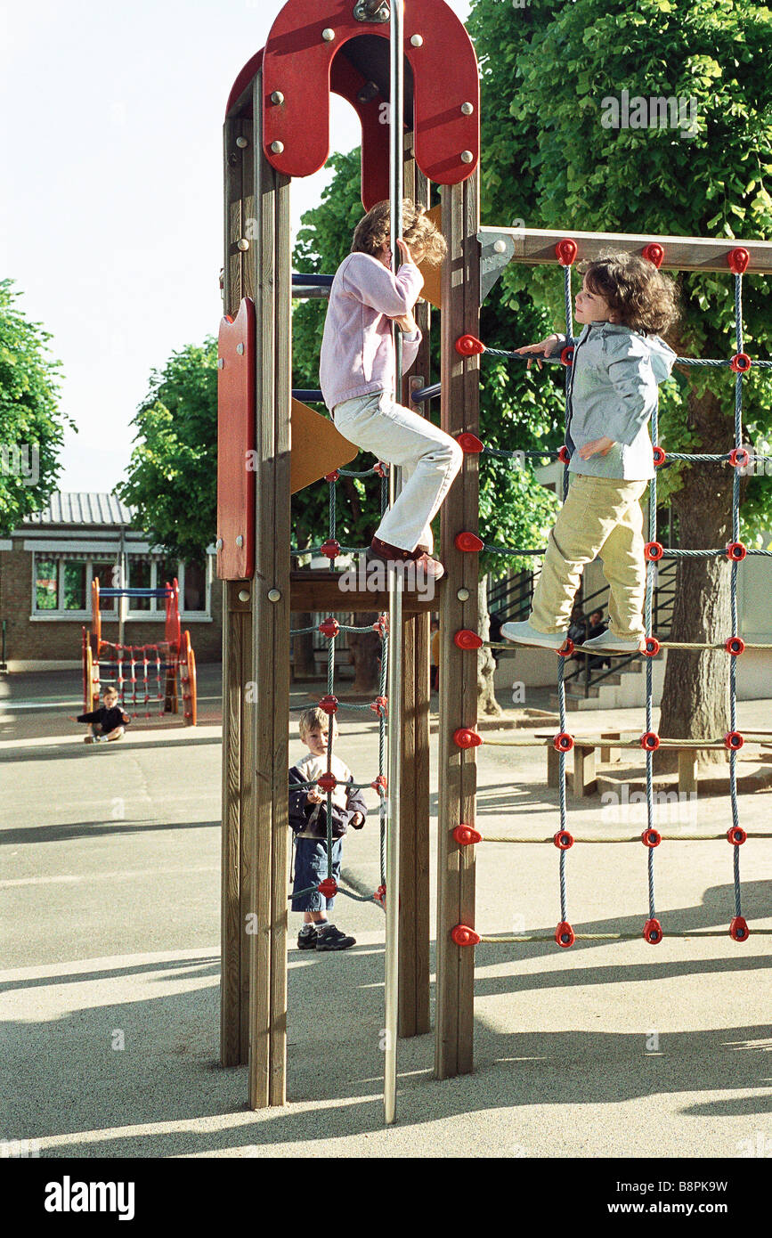 Children playing on jungle gym at recess Stock Photo Alamy