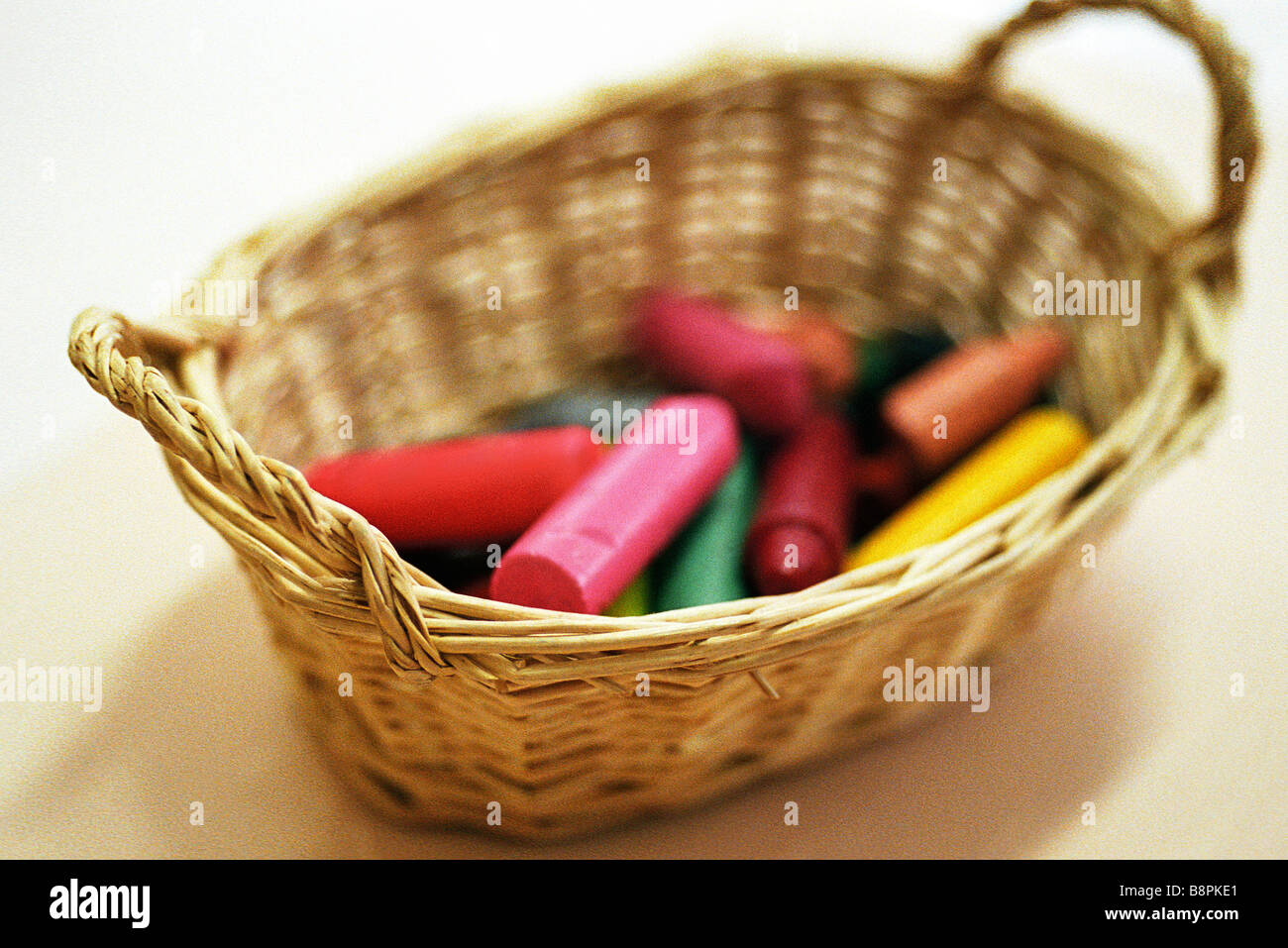 Basket full of crayons Stock Photo Alamy