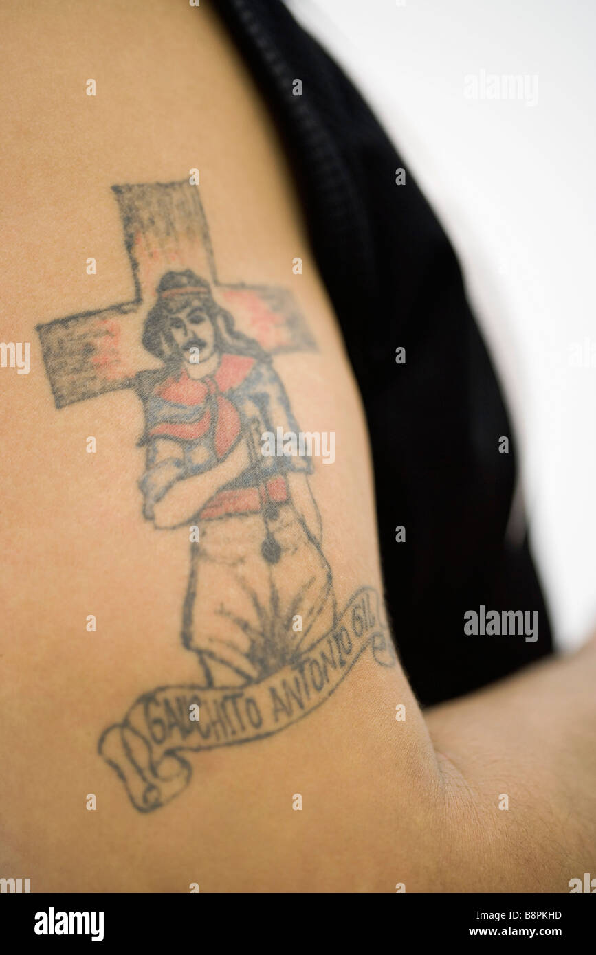 Tattoo of Gauchito Antonio Gil (Little Gaucho Gil) on man's bicep Stock Photo