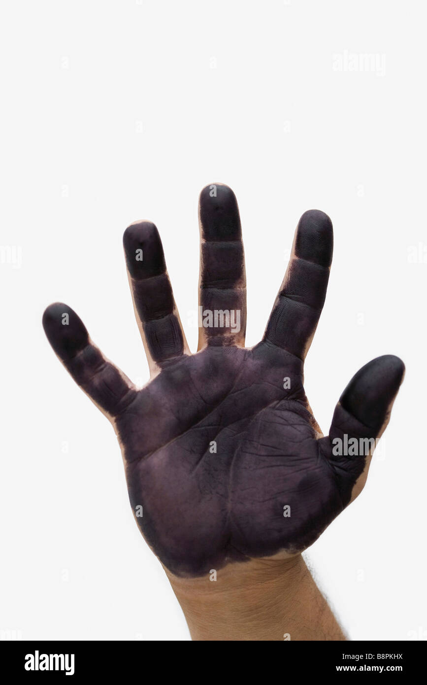 Man's hand with black paint on palm Stock Photo Alamy
