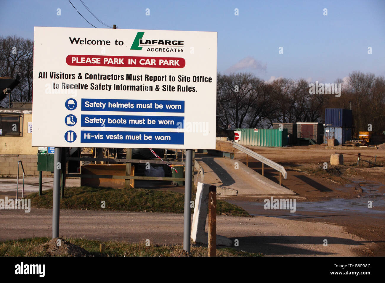 gravel quarry site entrance welcome board to cromwell quarry run by lefarge aggregates Stock Photo