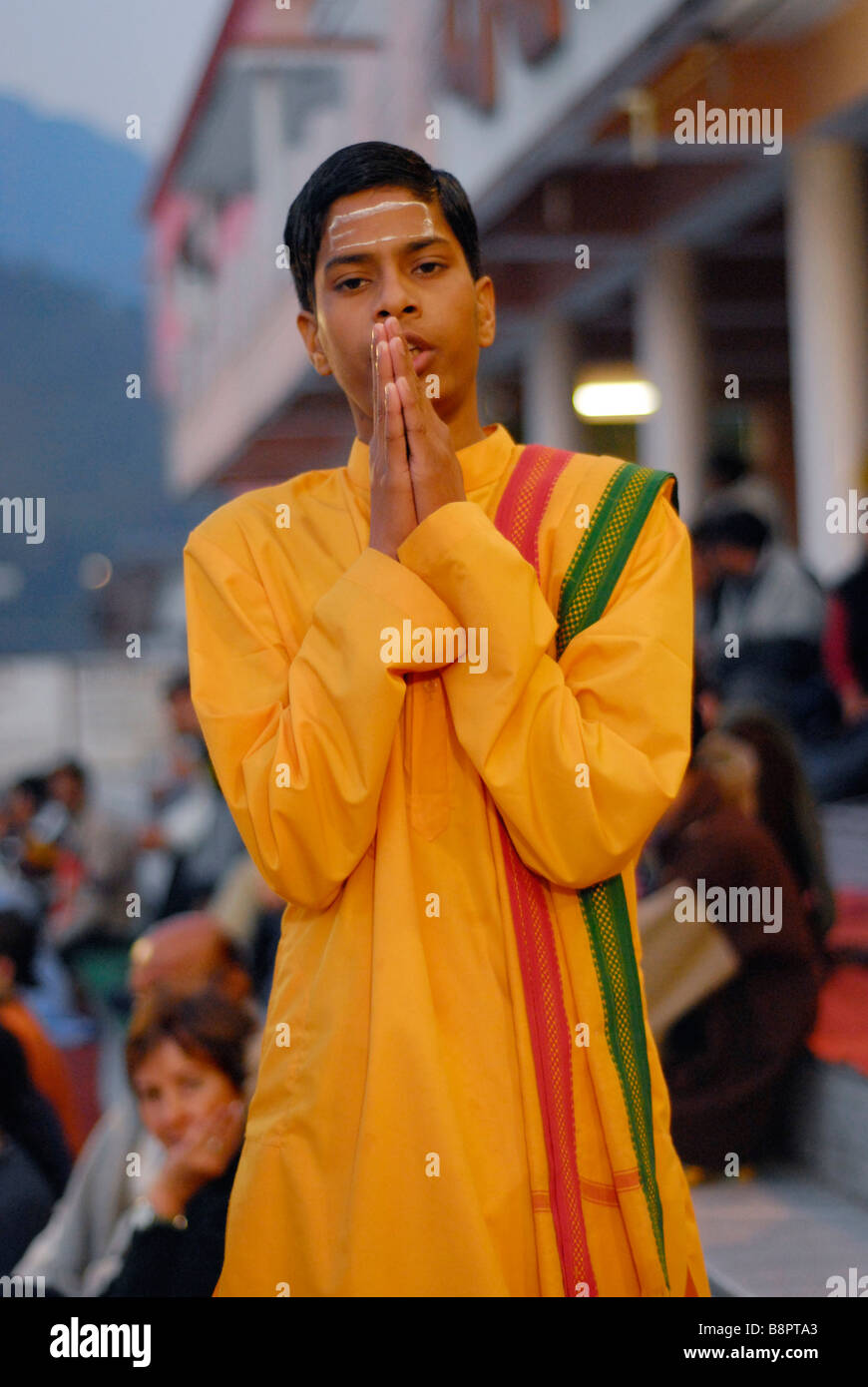 A boy in prayer during the Ganga Aarti. Rishikesh, Uttaranchal, India Stock Photo