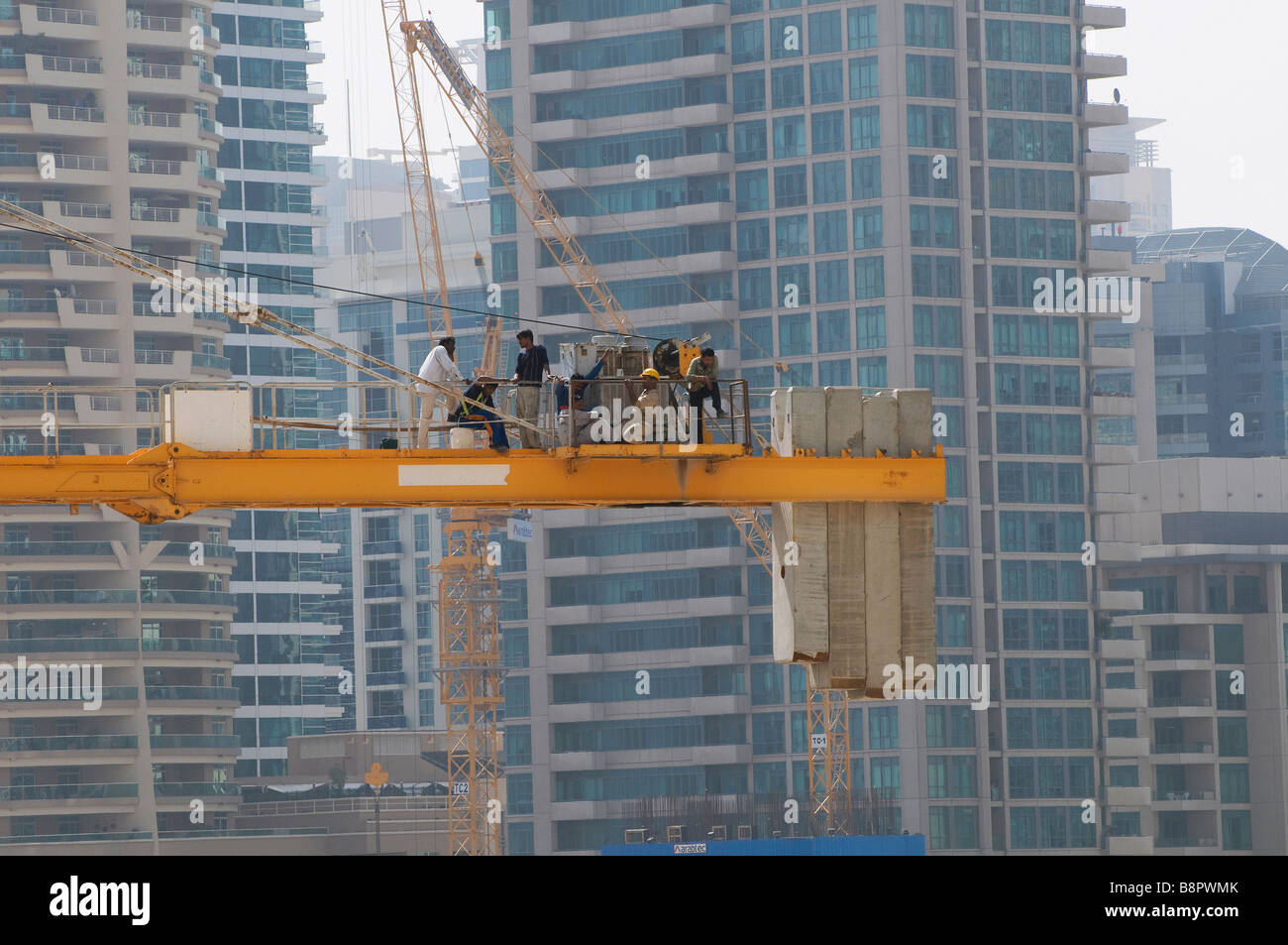 workmen on crane, dubai, uae Stock Photo Alamy