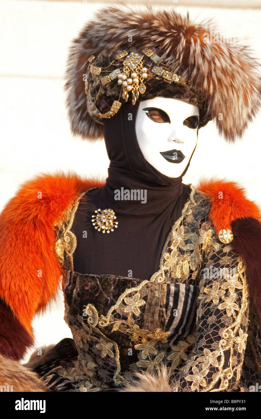 Venice Carnival. 1/2 length girl woman white face hat red Costume mask