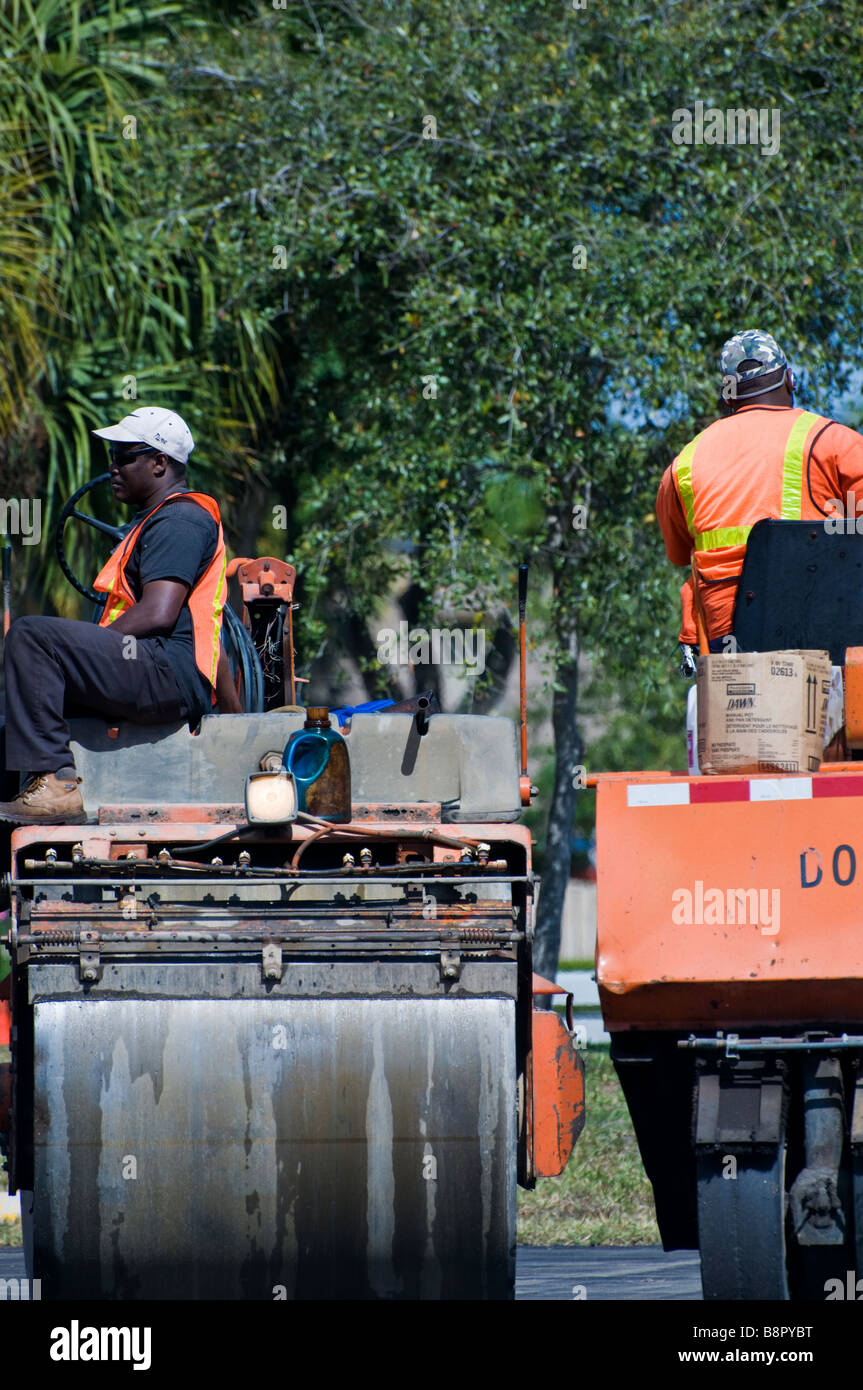 Construction workers laying new asphalt in Delray Beach, Florida Stock