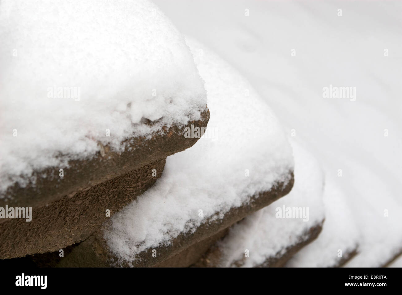 Old staircase steps covered with snow in winter. Stock Photo