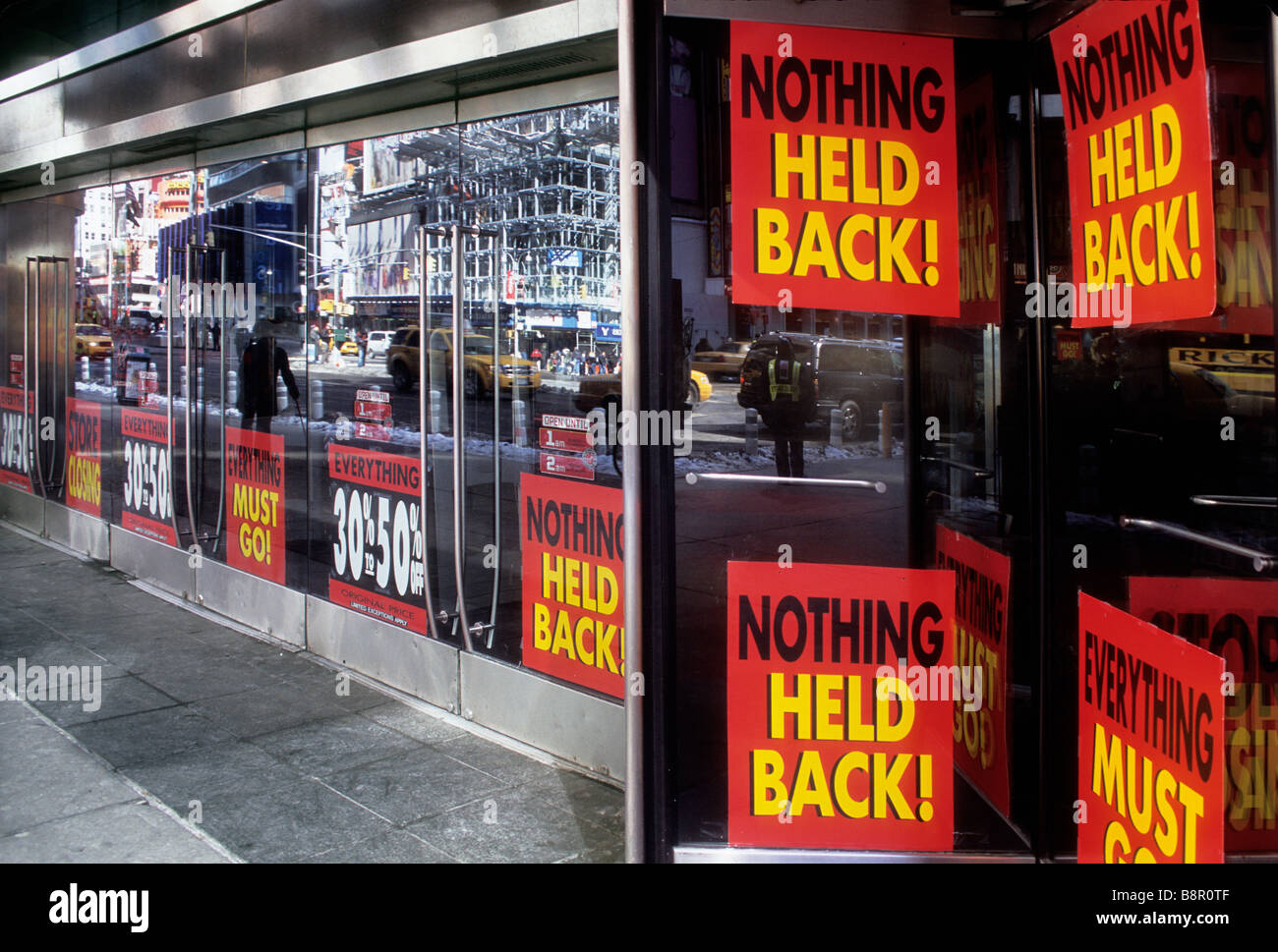 USA New York City Broadway and Times Square Going out of business. Stores closing down window signs. Economic downturn financial crisis. Vacant shops. Stock Photo