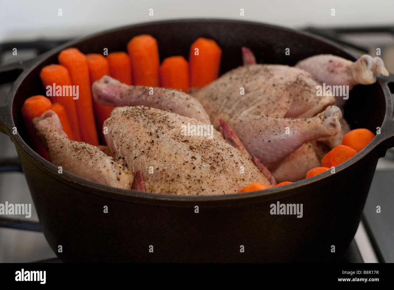 Cornish game hens being prepared to roast Stock Photo Alamy