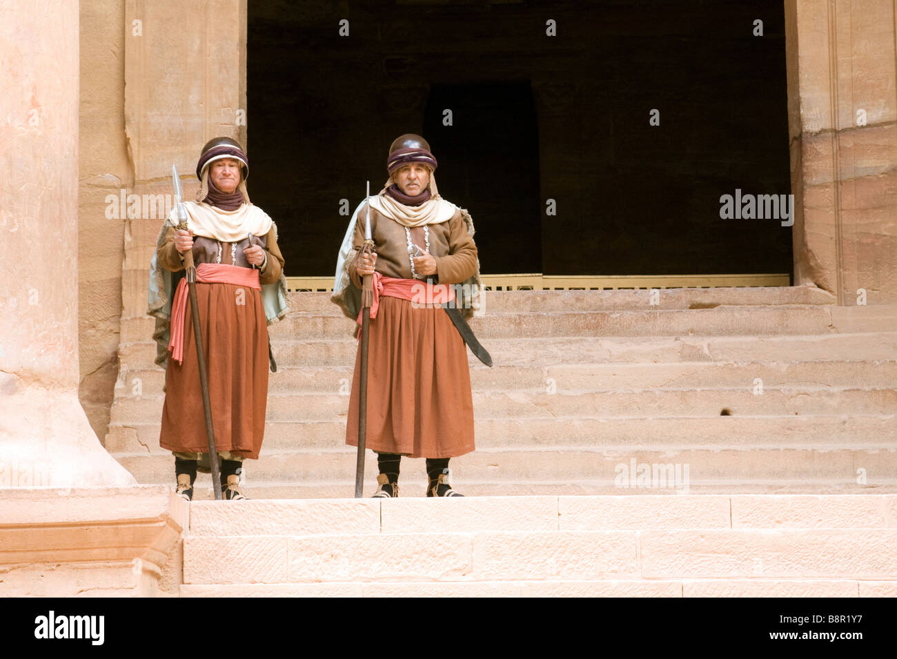 Men dressed as Nabatean Guards at the Treasury, Petra, Jordan Stock Photo