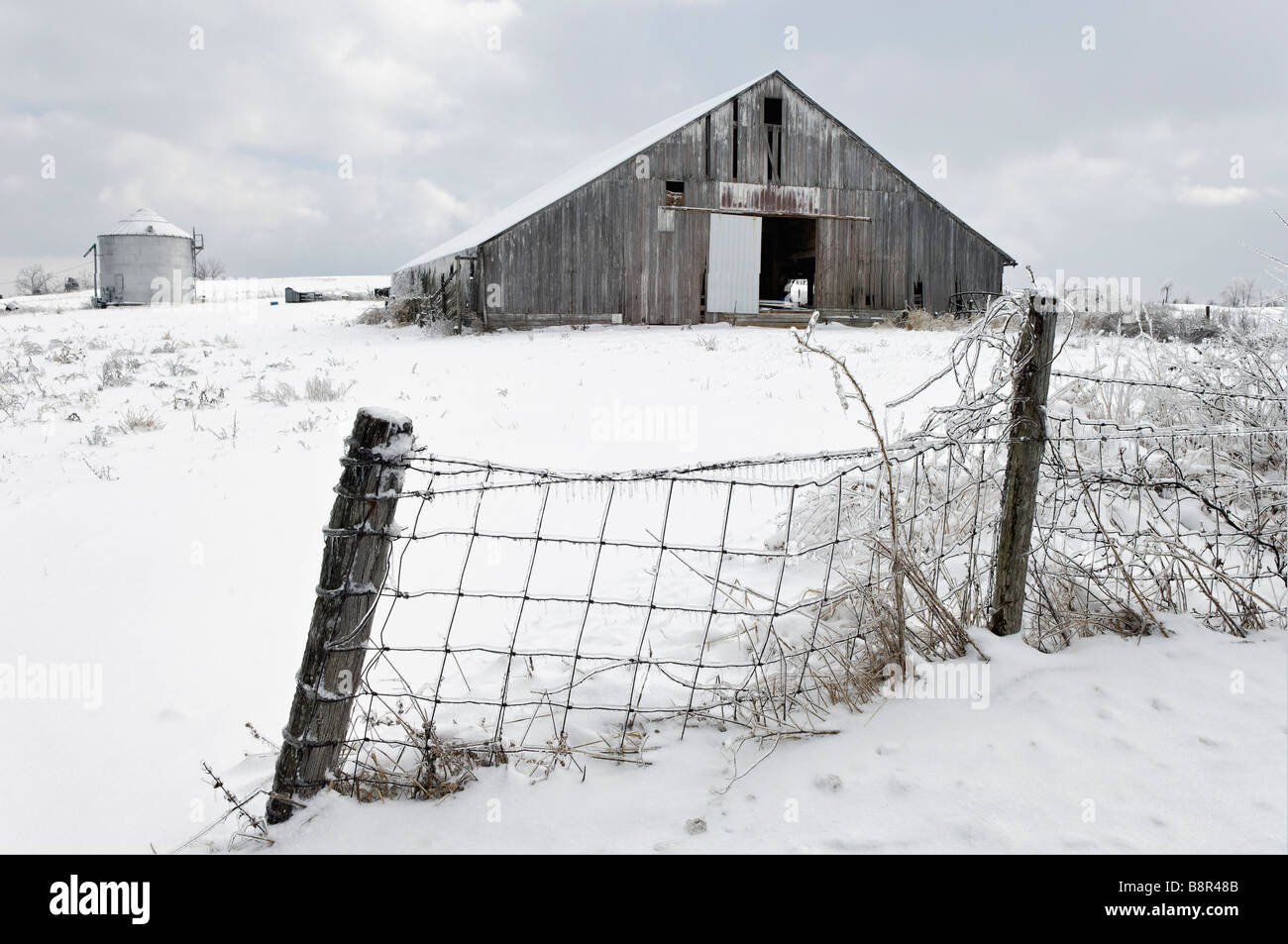Midwestern Farm Covered in Snow and Ice after Ice Storm in Floyd County Indiana Stock Photo
