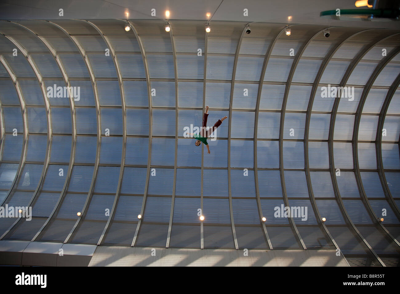 Human figure hanging high under the dome roof Stock Photo