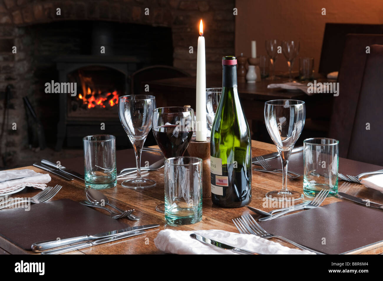 A table laid for dinner in the dining room at The Stagg Inn, Titley, Herefordshire, UK, the first Michelin-starred pub in Britain Stock Photo