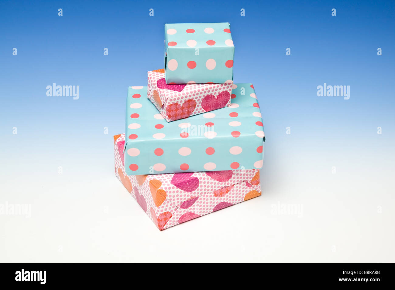Presents or gifts on a graduated blue studio background Stock Photo