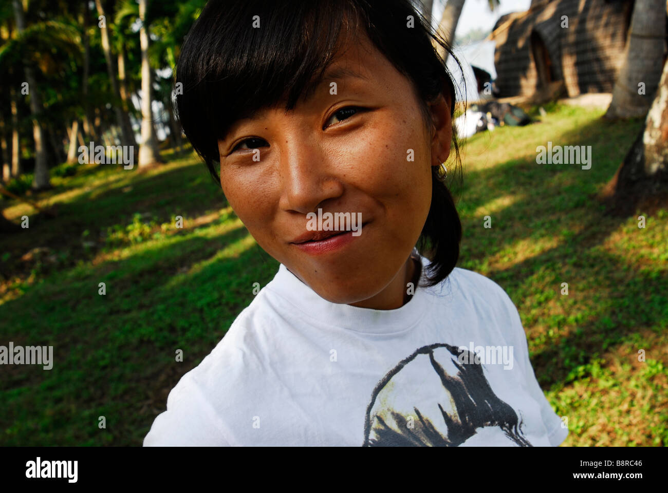 A young woman amongst the palm trees Stock Photo - Alamy