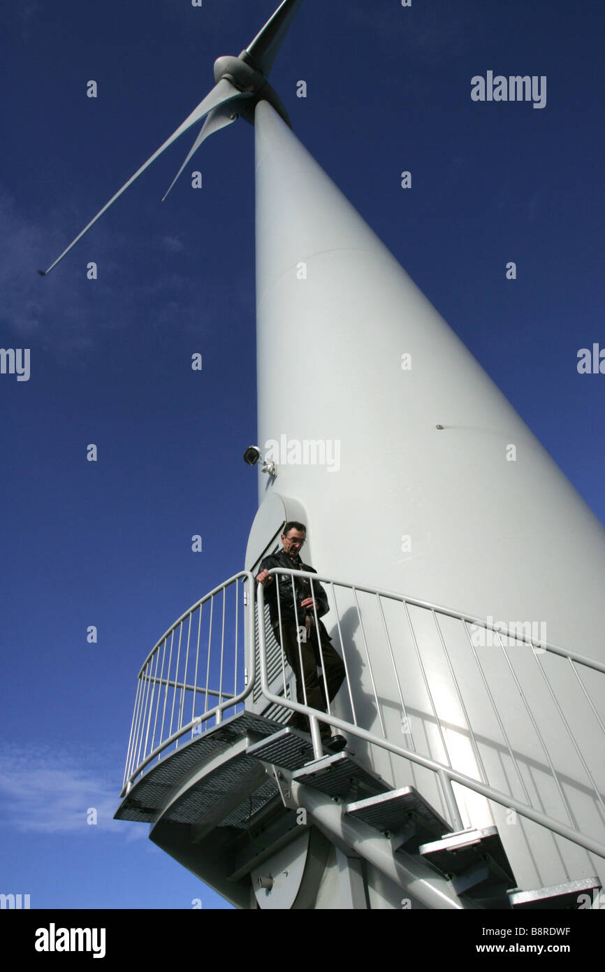 Man going down the stairs of a wind turbine in Alto Minho in the north of Portugal. Stock Photo