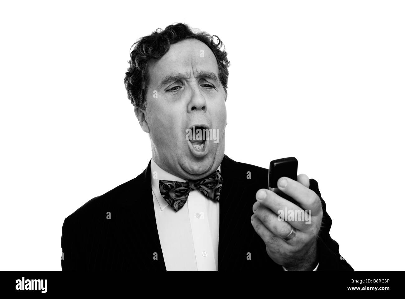 businessman shouting down a phone Stock Photo