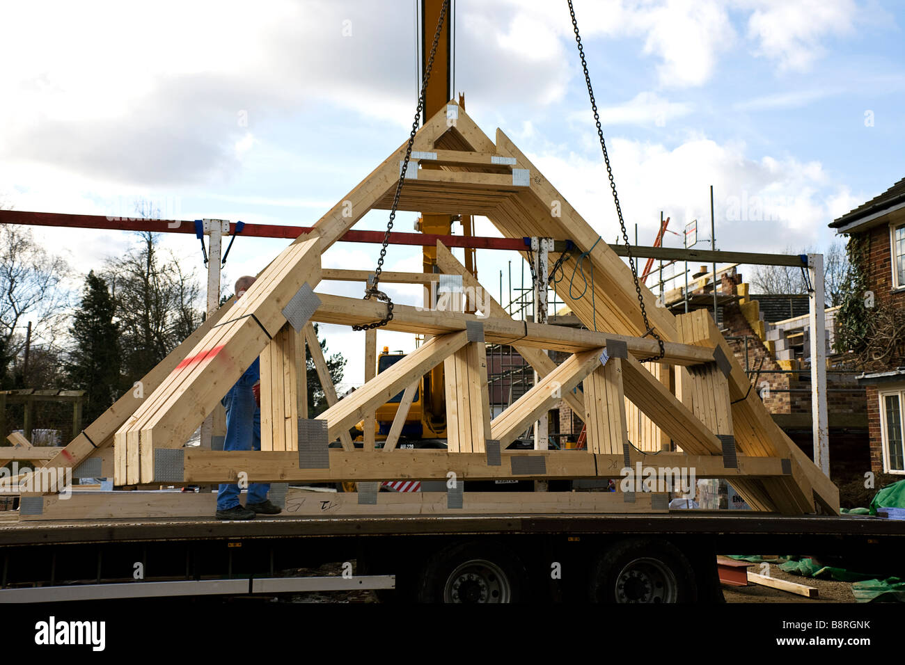 Preparing to lift a delivery of roof trusses, from a consignment of