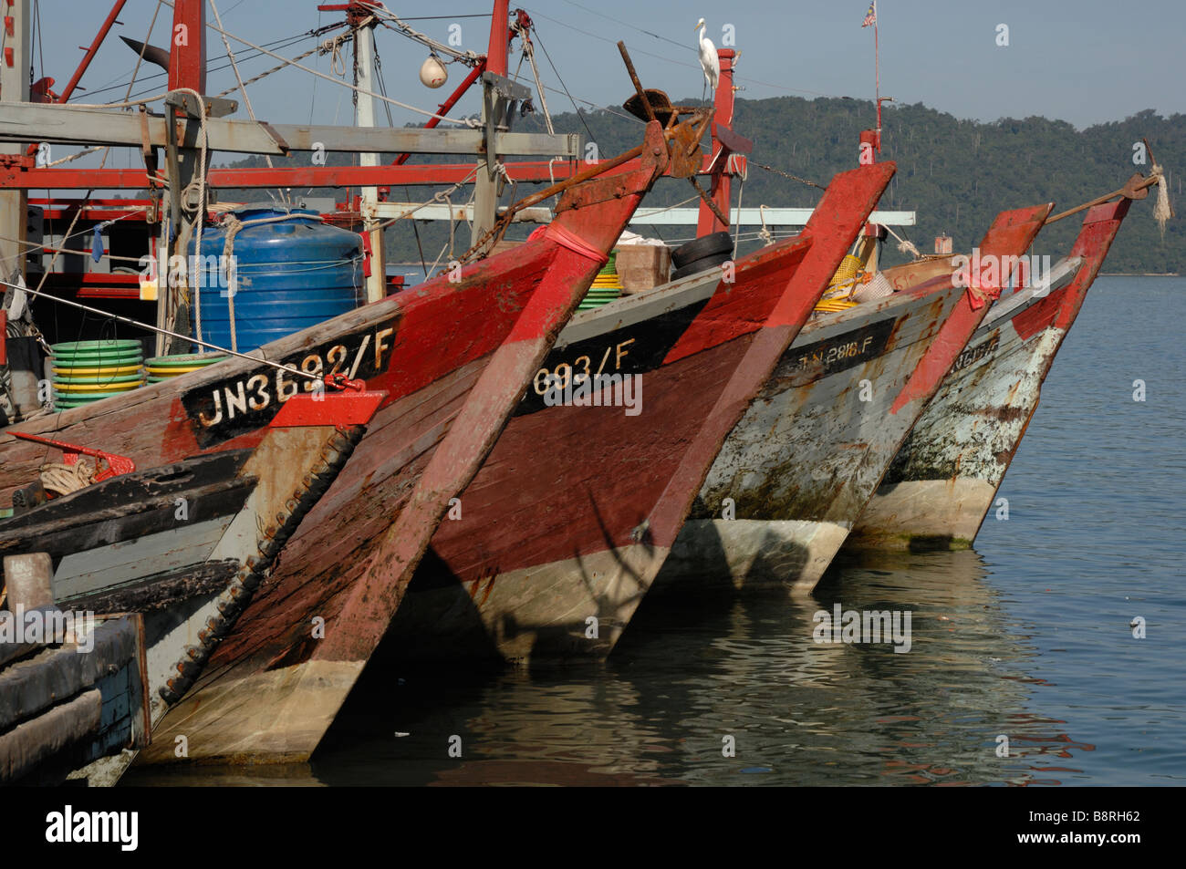 Traditional fishing boat in harbour SAFMA fish market Kota Kinabalu Sabah Malyasia Borneo South