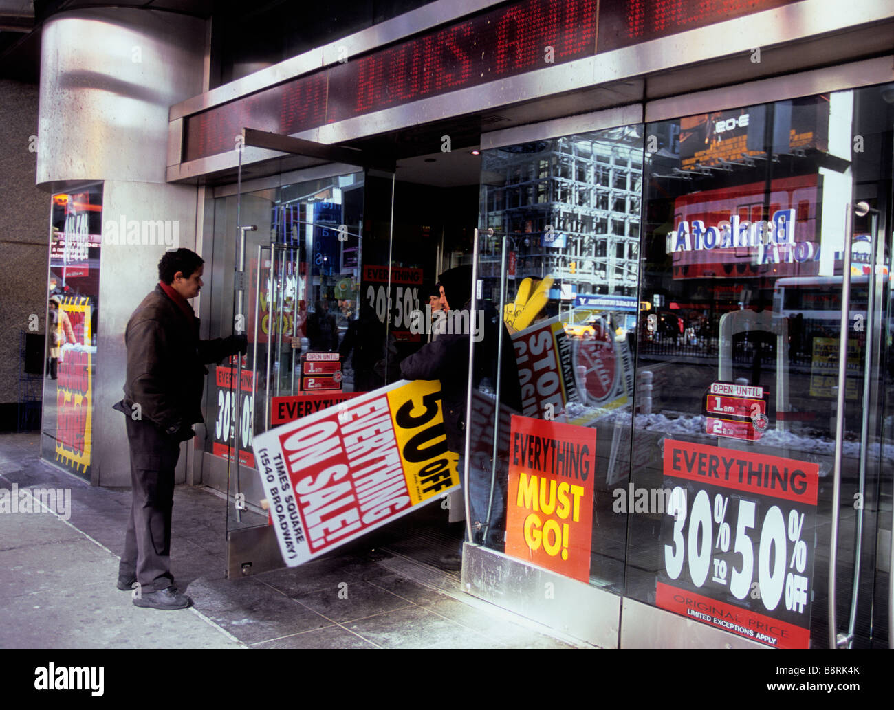 USA New York Broadway and Times Square Store going out of business sale New York City.Store closings and vacant shop windows in world financial crisis Stock Photo