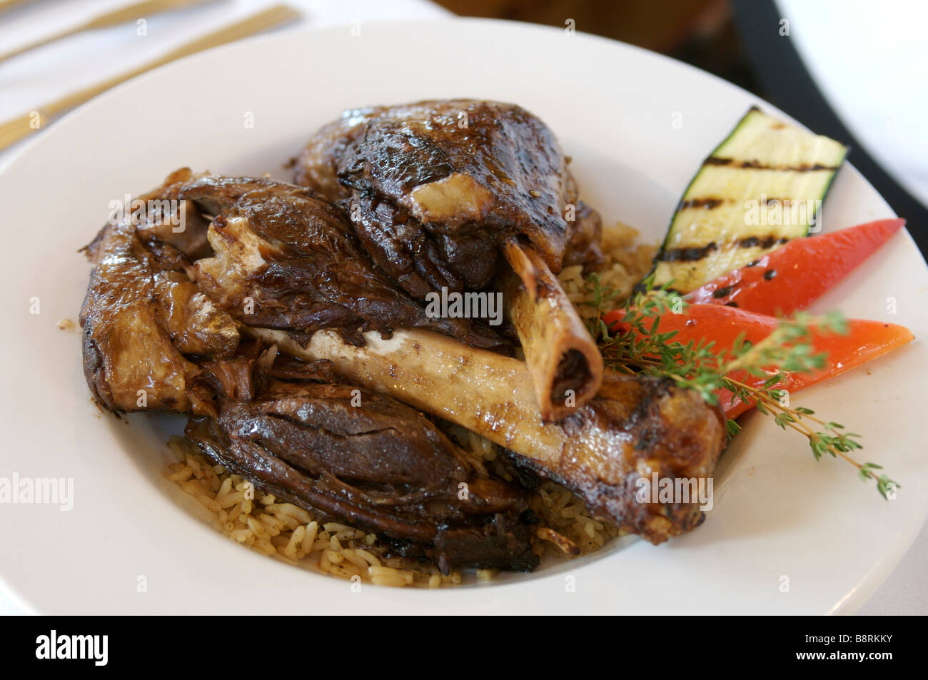 Grilled lamb shanks Stock Photo - Alamy