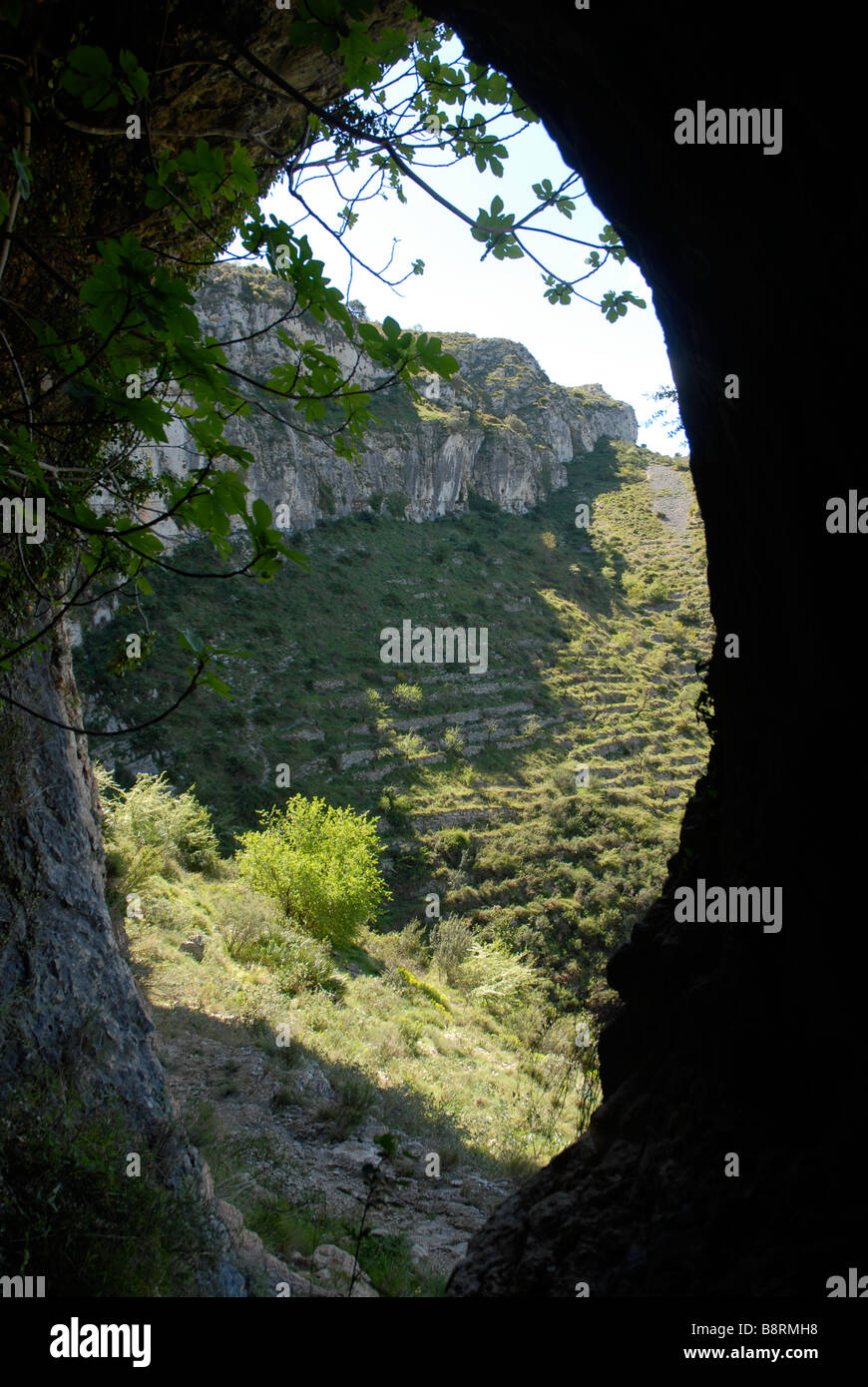 looking out of a cave, off Mozarabic trail, Vall de Laguart, Benimaurell, Alicante Province, Comunidad Valenciana, Spain Stock Photo