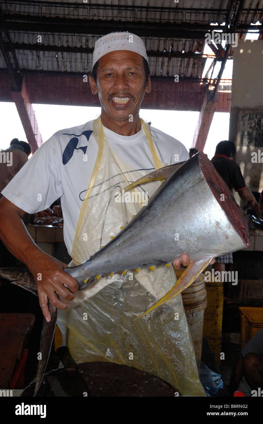 Man holding body of yellow fin tuna Fish for sale interior of SAFMA