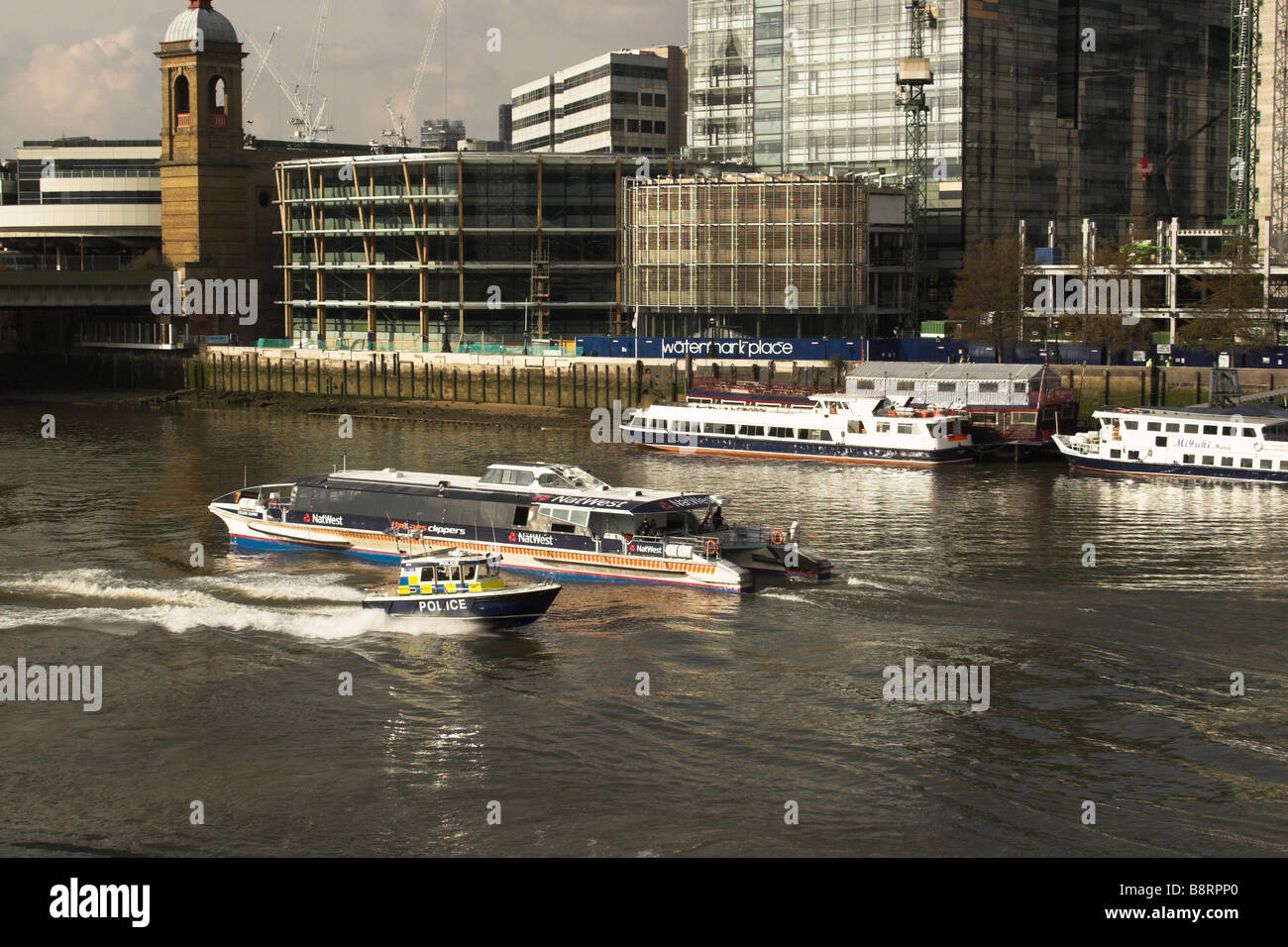 A police launch powers up the River Thames near London Bridge. Stock Photo