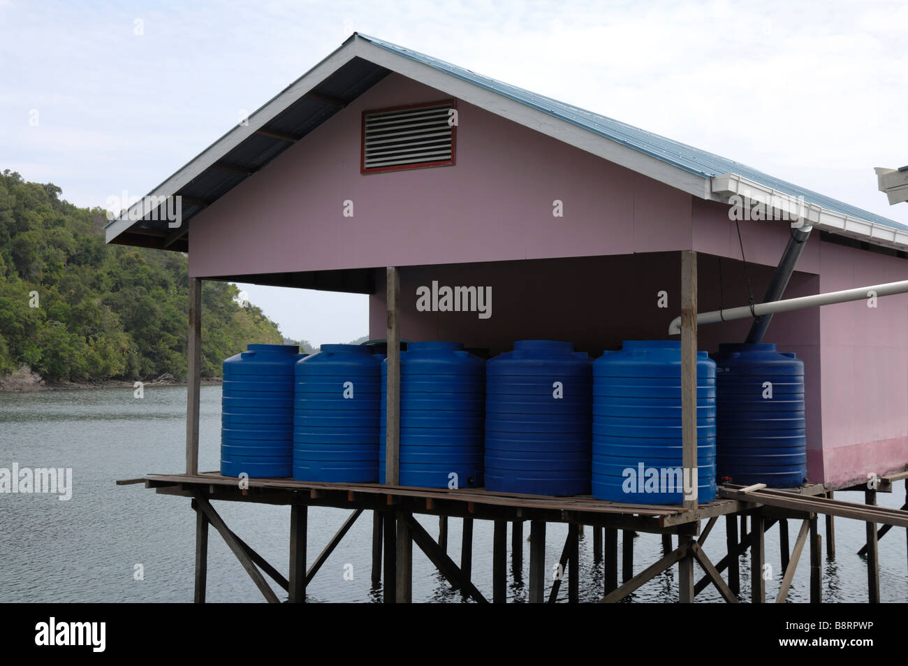 Fresh rain water collection from roof Japanese pearl farm Darvel Bay Sulu Sea Malaysia South east Asia Stock Photo