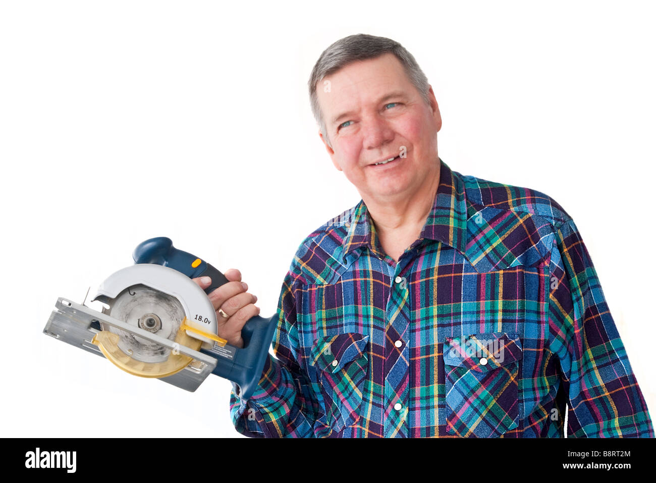 Portrait of mature handyman with circular saw isolated on a white background Stock Photo