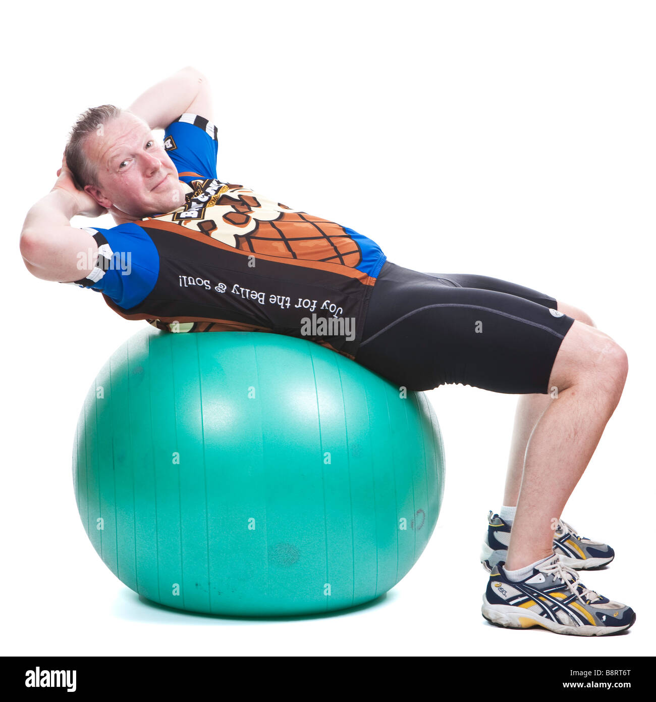 Man In Cycling Gear Swiss Ball Sit Up Facing Viewer Stock Photo - Alamy
