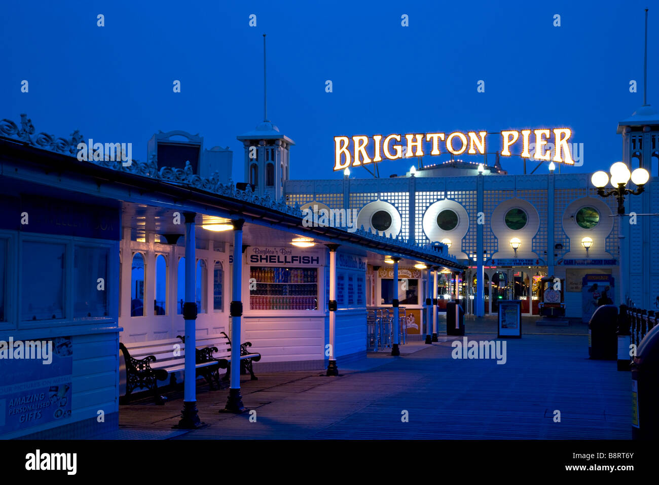 Palace Pier at night, Brighton, East Sussex, England. Stock Photo