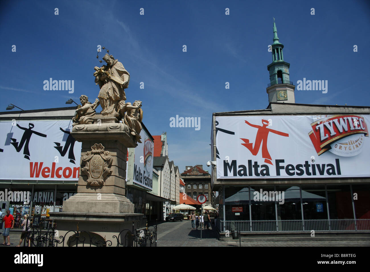 Statue of St John Nepomuk on Old Town Square over Renaissance Town Hall , Poznan, Poland Stock Photo