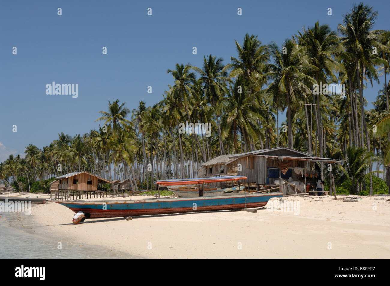 Suluk boats and houses along beach Pulau Maiga Semporna Sulu Sea Malaysia Sout east Asia Stock Photo
