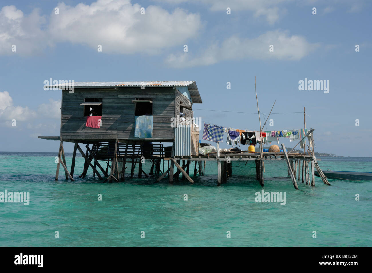 Suluk seaweed fishermen's house on stilts on reef flat Semporna Sulu Sea Malaysia South east Asia Stock Photo
