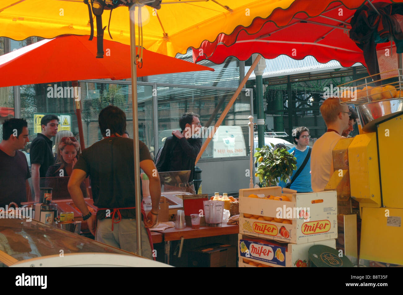 Stalls, traders and buyers at Borough Market, London. Stock Photo
