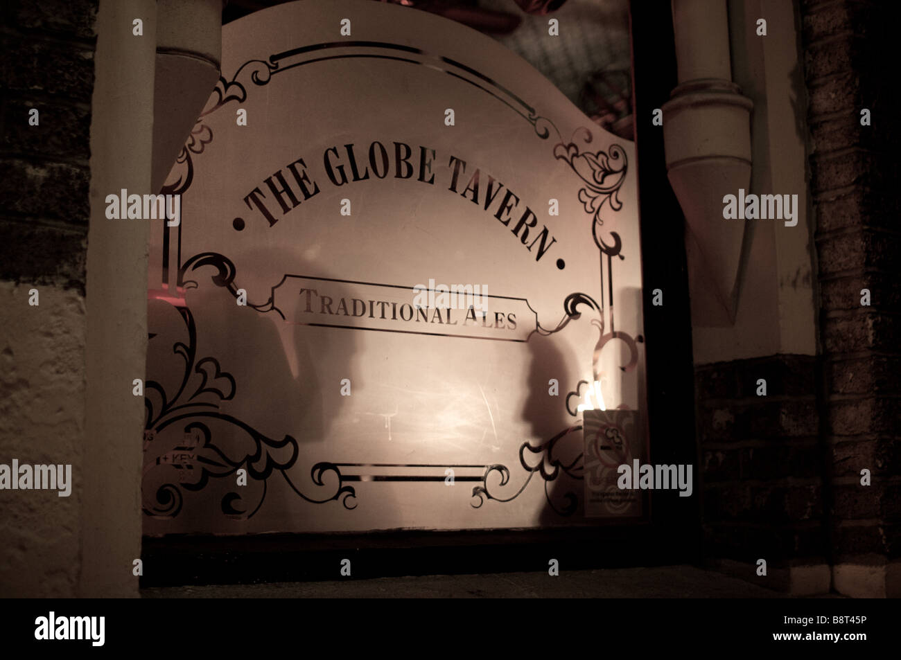 Two men having a conversation in the Glove Tavern pub Borough Market London at night Stock Photo
