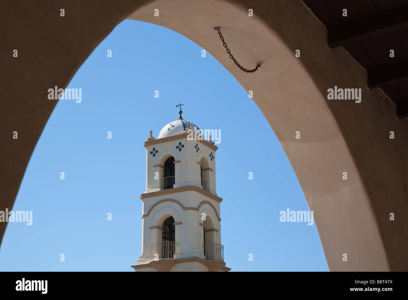 Detail of bell tower of the post office in Ojai California, colonial revival architecture, framed by an archway of the arcade. Stock Photo