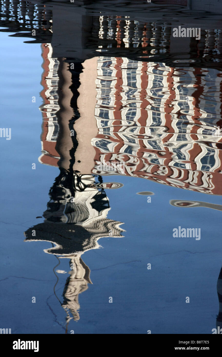Reflection of T.I. Hotel and statue of St Theodore of Amasea in pool in front of The Venetian Resort Hotel, Las Vegas Stock Photo