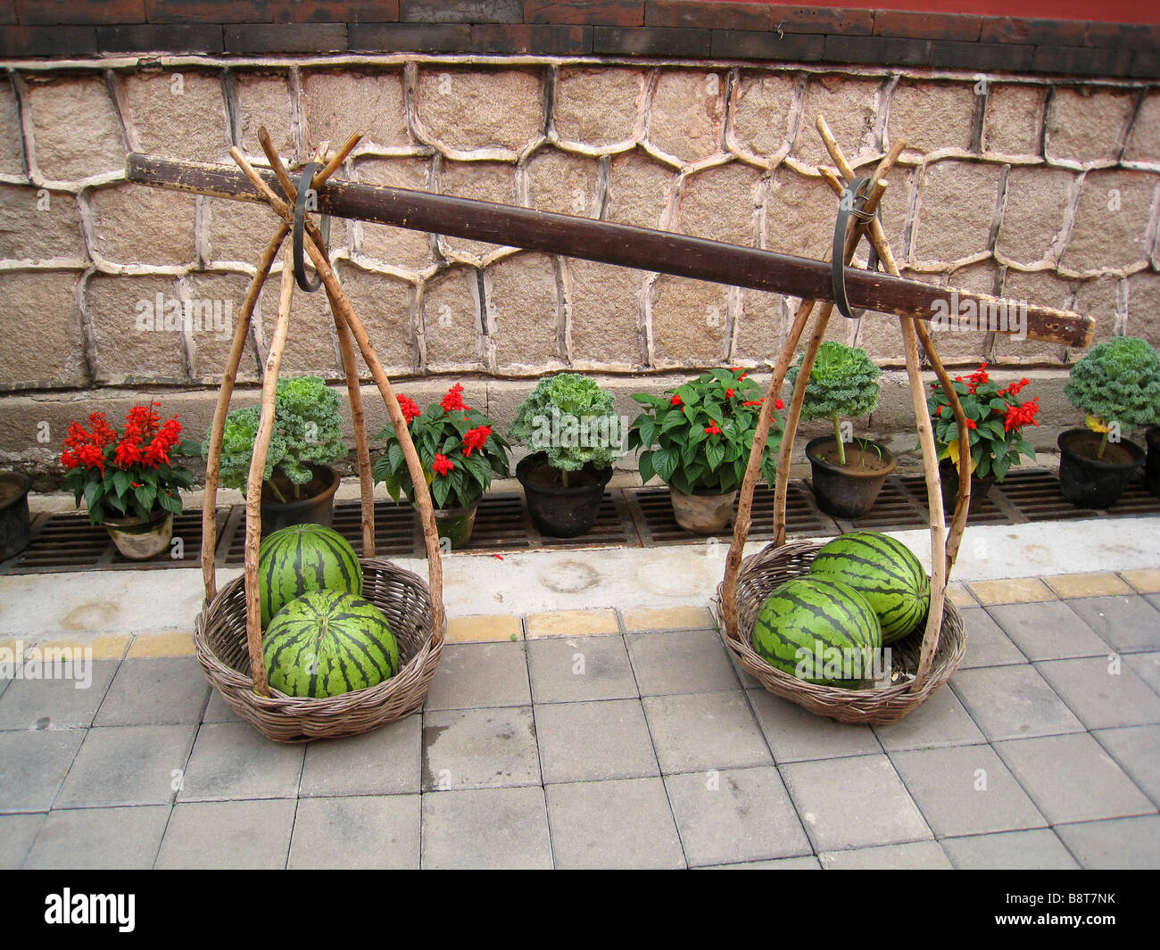 Watermelons in a carrying yoke, Chengde, China Stock Photo
