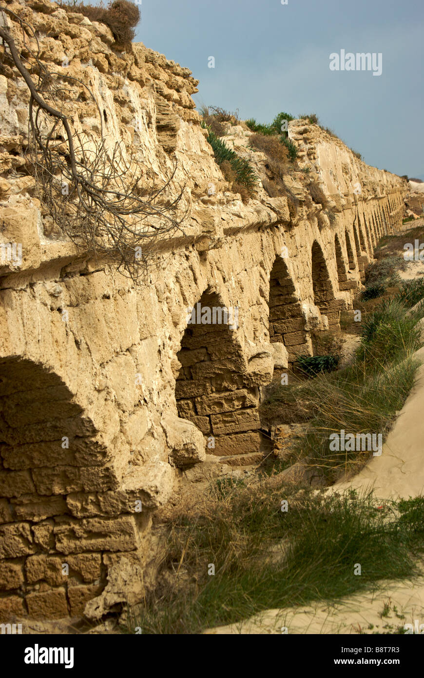 Remains of stone arch supported aqueduct that King Herod constructed to bring water from Mount Carmel to port city Caesarea Stock Photo