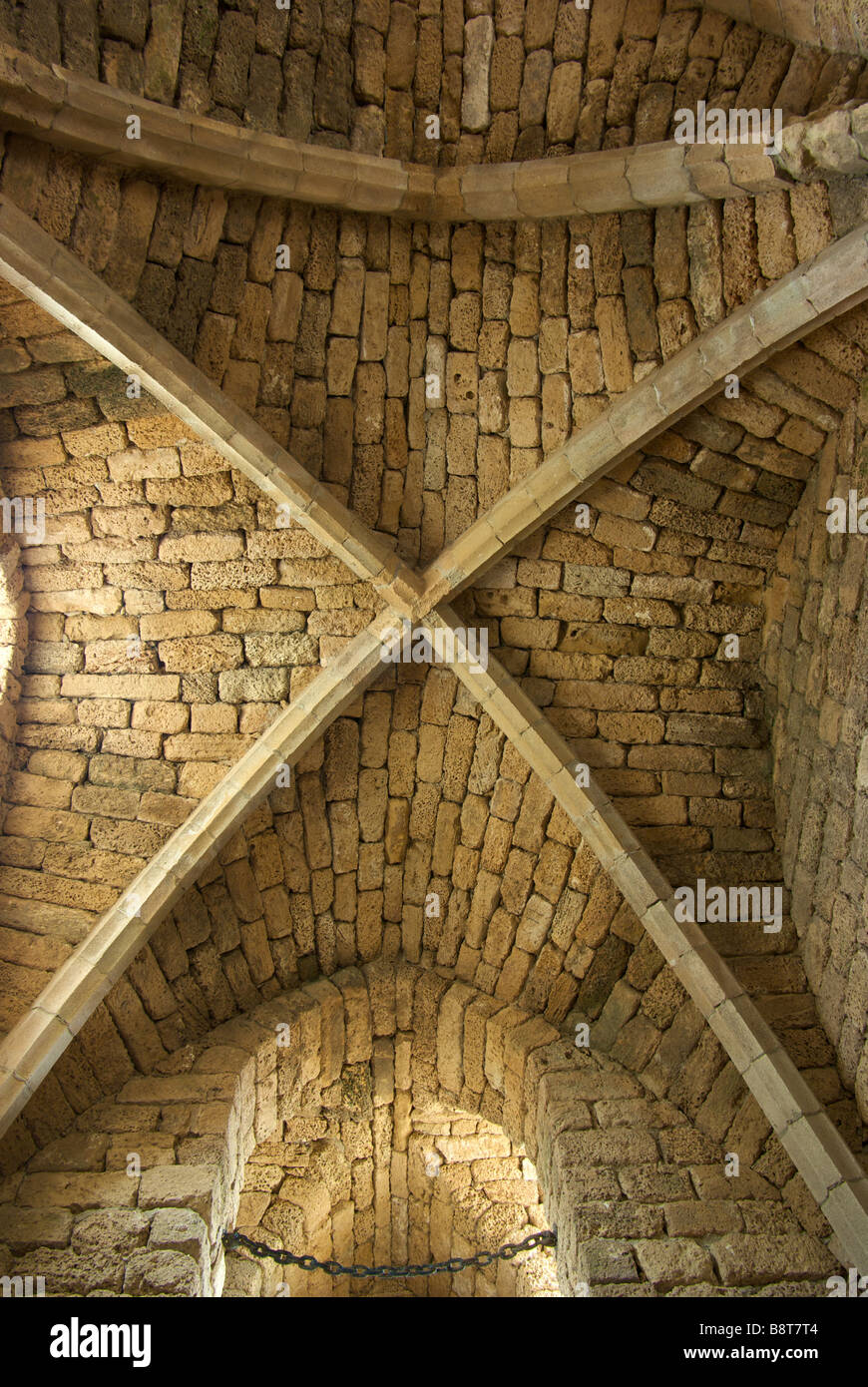 Steeply arched vaulted ceiling of Crusader fort dating to 1250 AD built over ruins of King Herod built port Caesarea Stock Photo