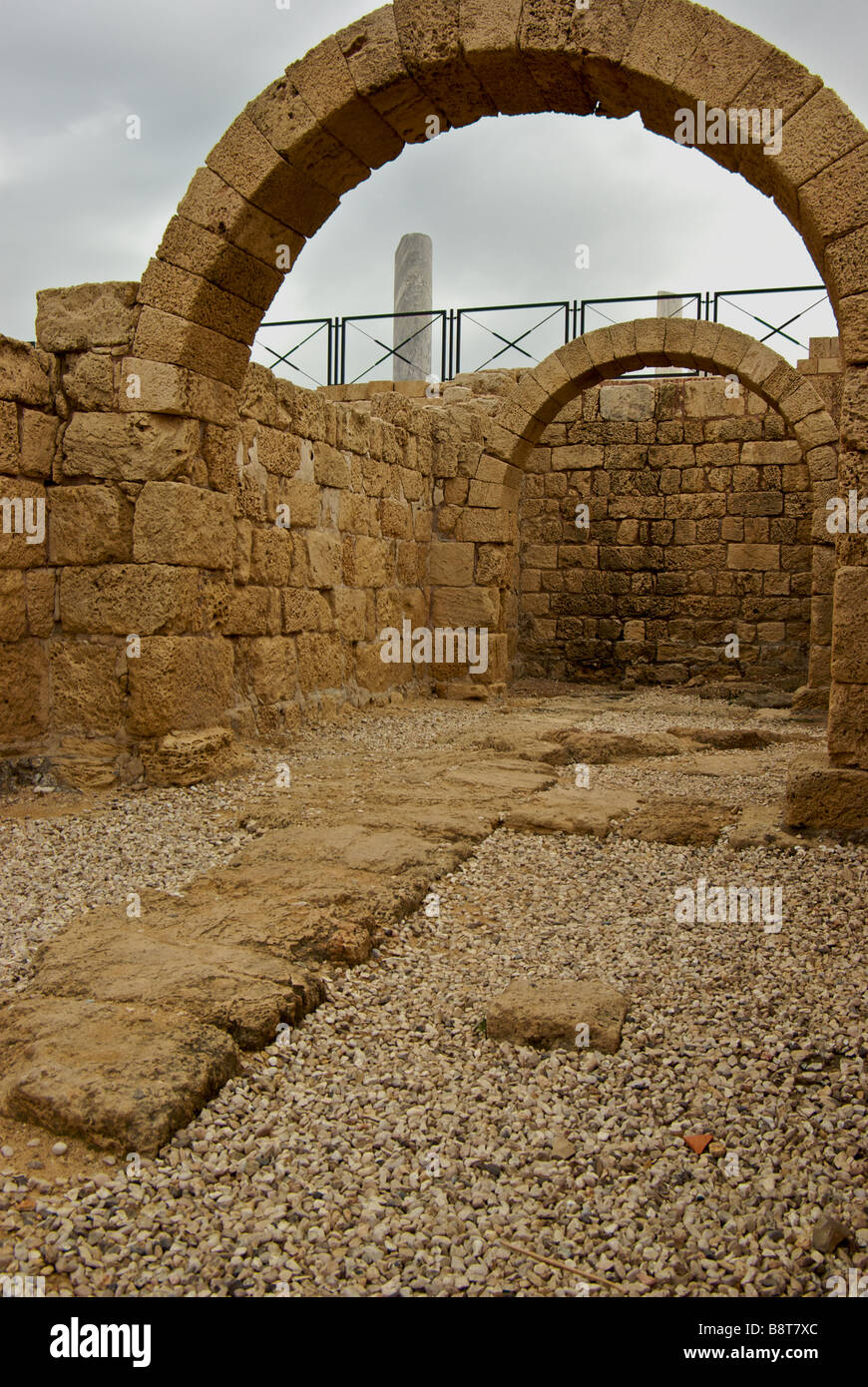 Ruins arch supported chambers in giant seaside Chariot racing arena in King Herod built port Caesarea Stock Photo