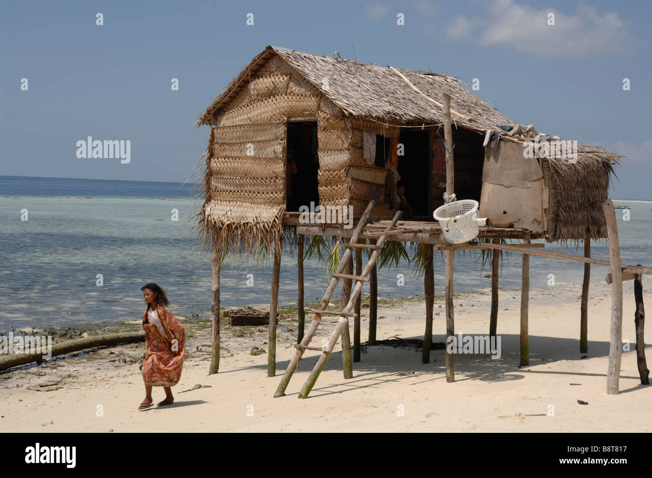 Bajau house on wooden stilts and woman walking Pulau Maiga Semporna Sabah  Malaysia Borneo South east Asia Stock Photo - Alamy