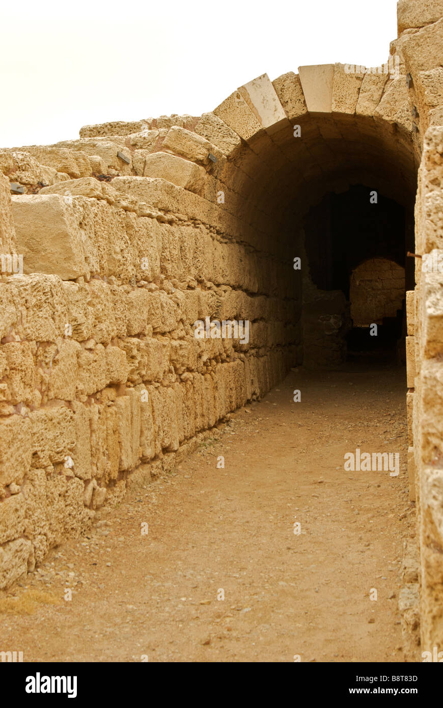 Covered arched vomitorium passageway in King herod built port Caesarea Stock Photo