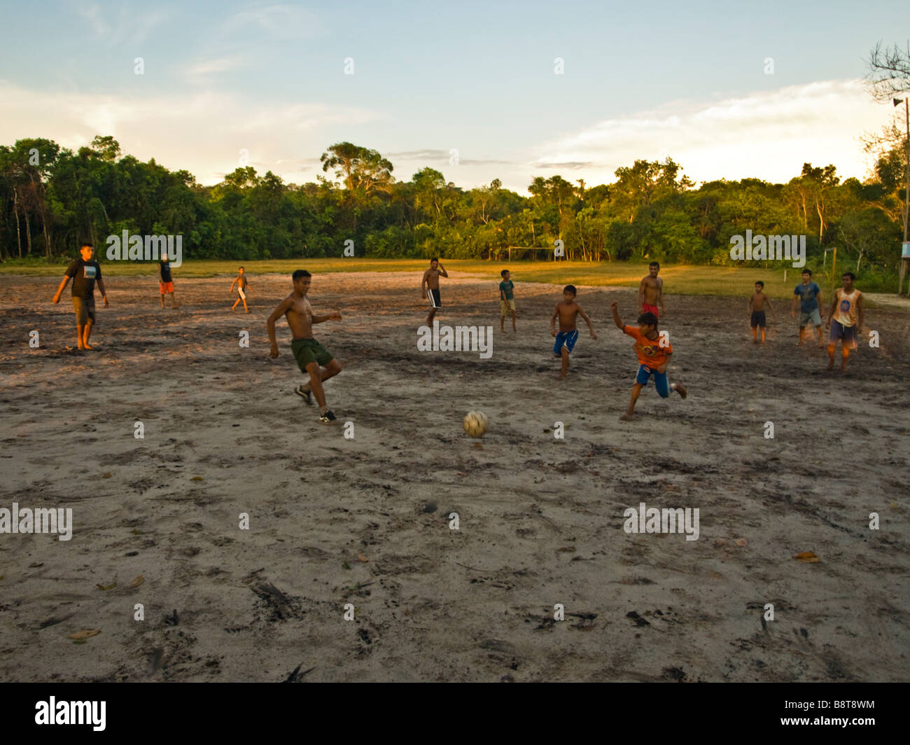 A football match with local boys in the Amazon village of Jamaraquá, Tapajos forest, Para