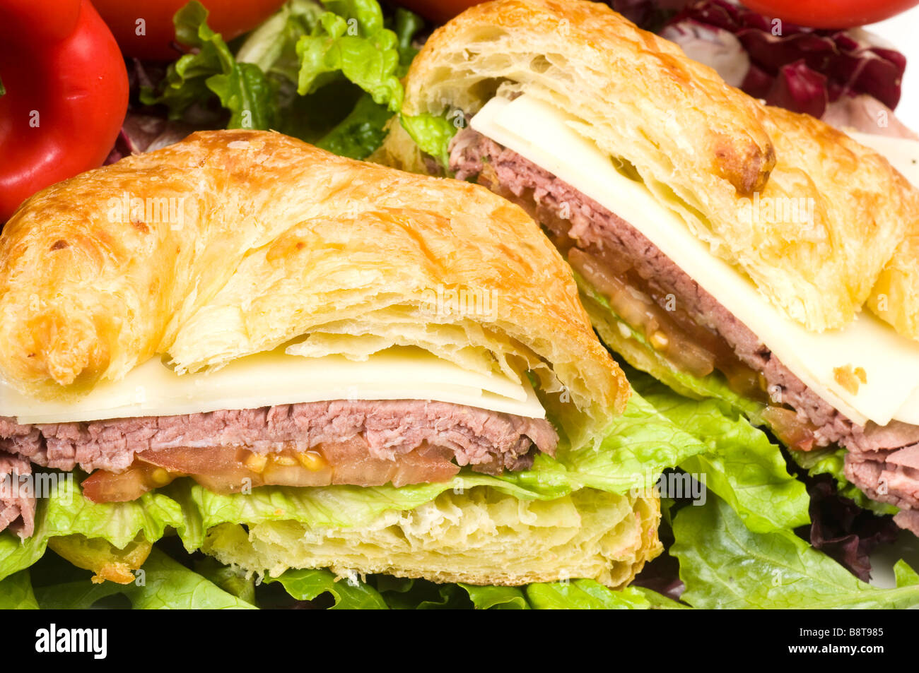 roast beef sandwich with swiss cheese on croissant french bread Stock