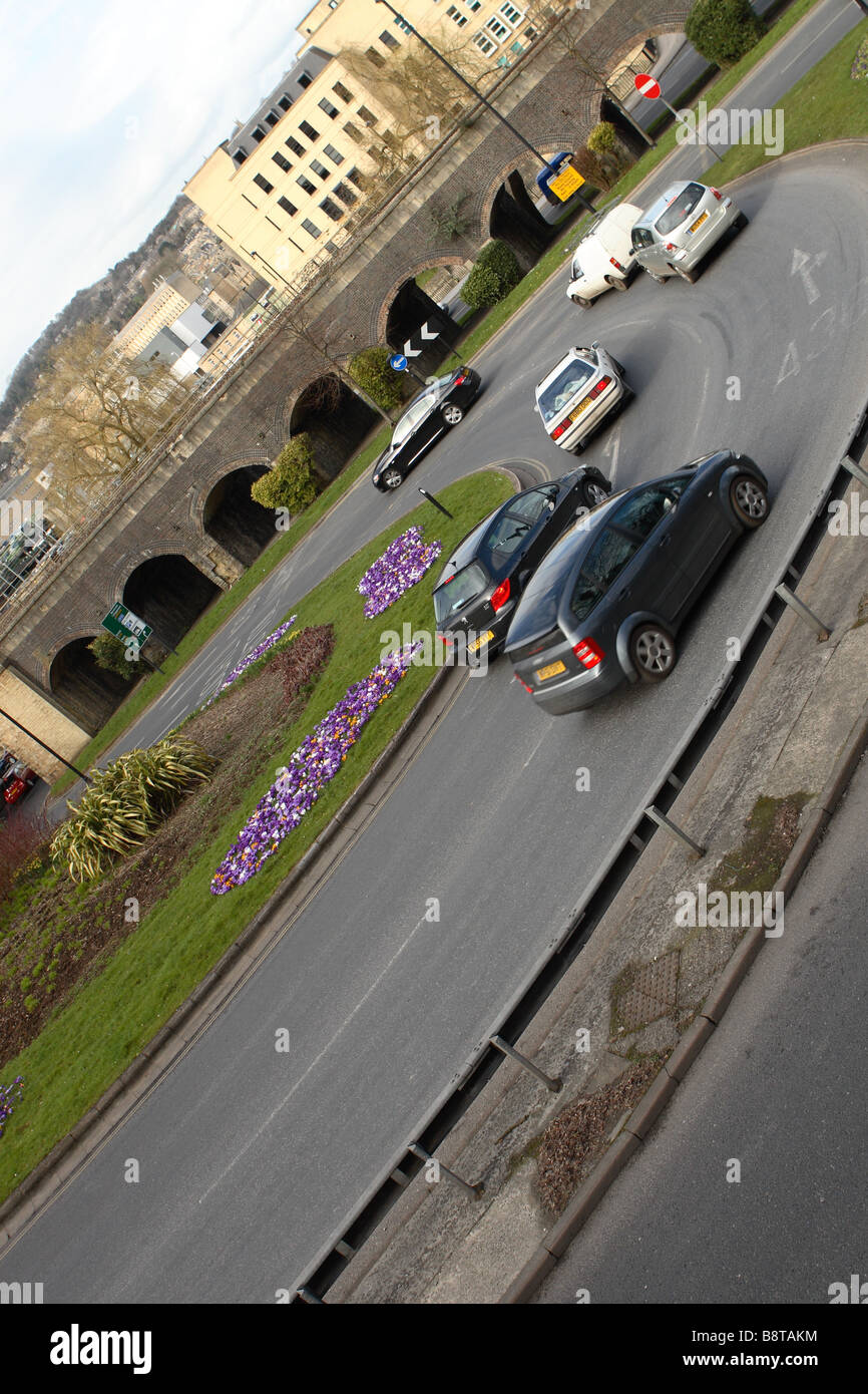 Road traffic flow vehicles approaching a roundabout junction in Bath