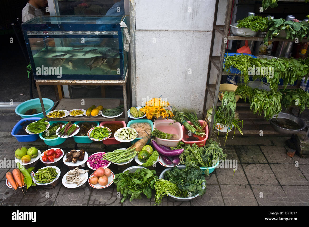 Fresh ingredients displayed at the entrance of a restaurant in Dali, Yunnan province, China. Stock Photo